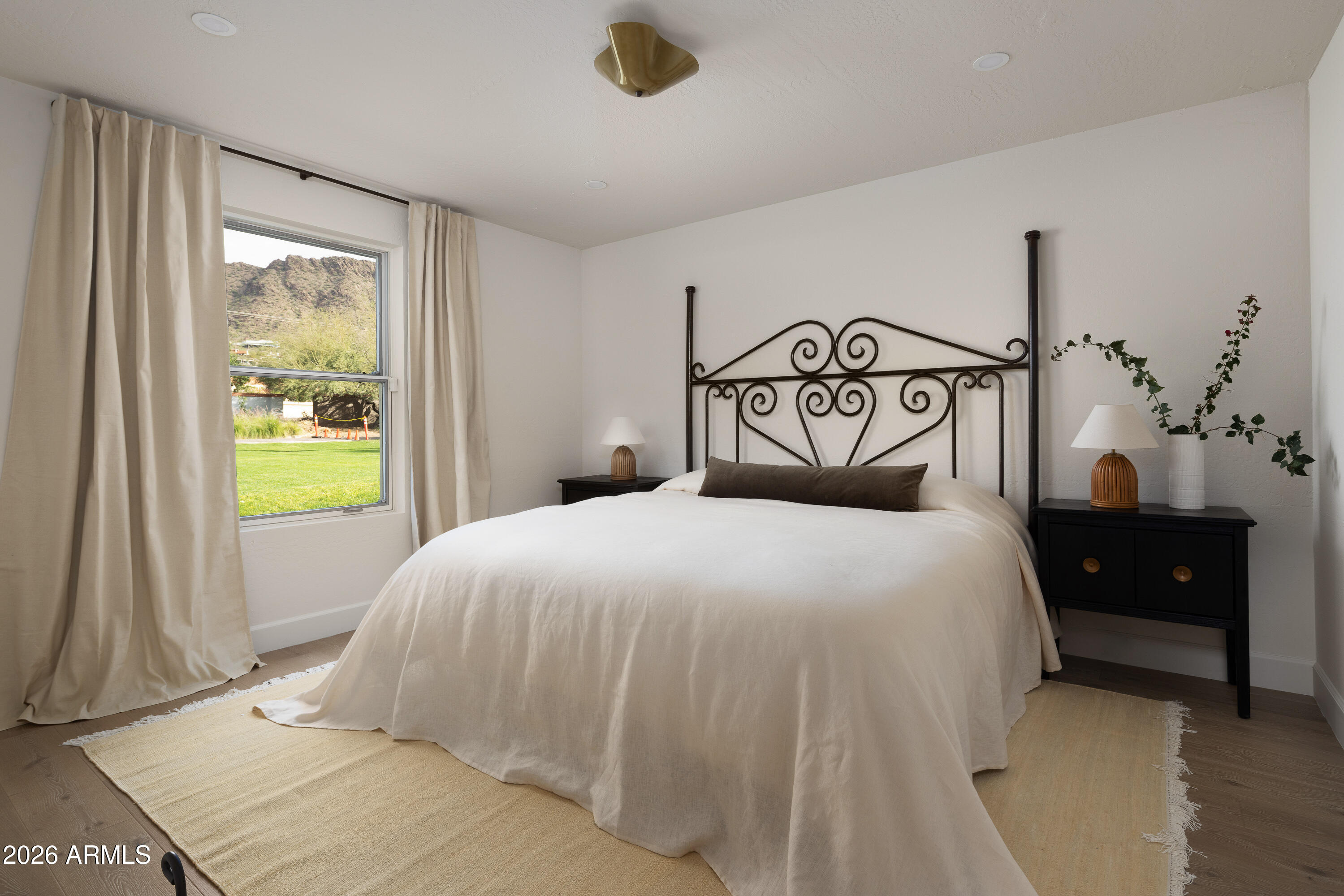 5501 East Camelback Road Phoenix, AZ 85018 - Photo 41 of 60 a bedroom with a bed and a window