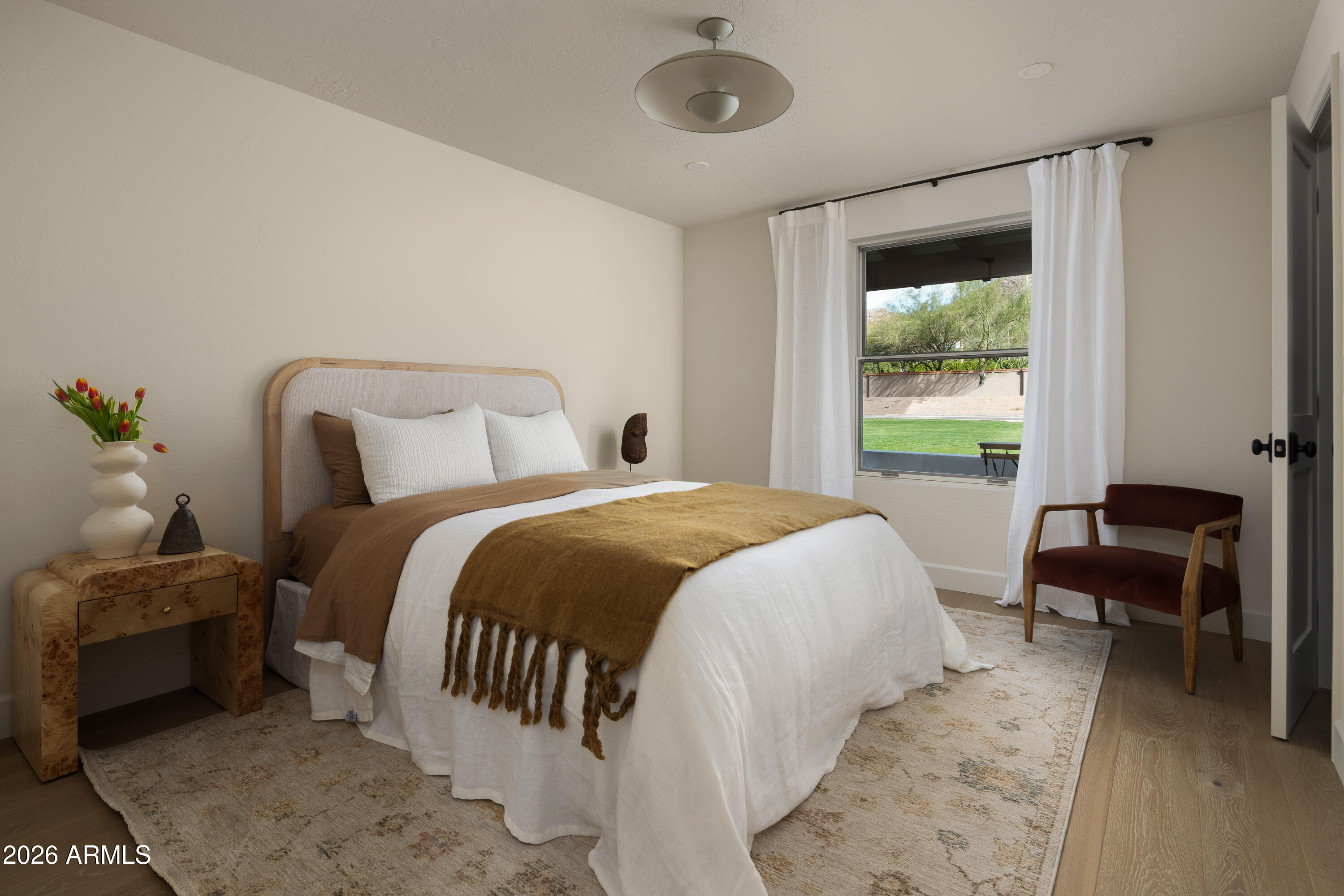 5501 East Camelback Road Phoenix, AZ 85018 - Photo 42 of 60 a bedroom with a bed and a window