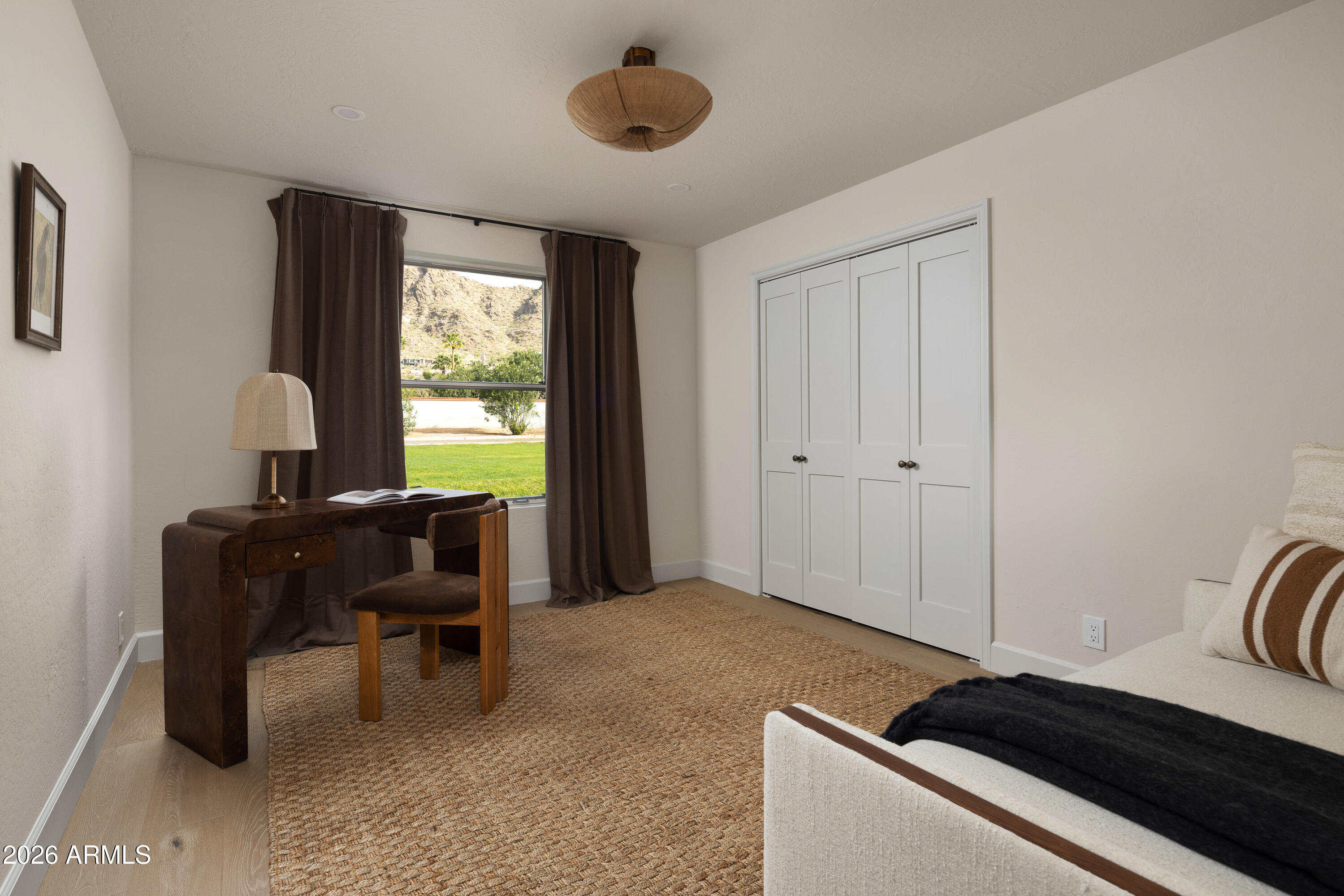 5501 East Camelback Road Phoenix, AZ 85018 - Photo 43 of 60 a bedroom with a bed and a window