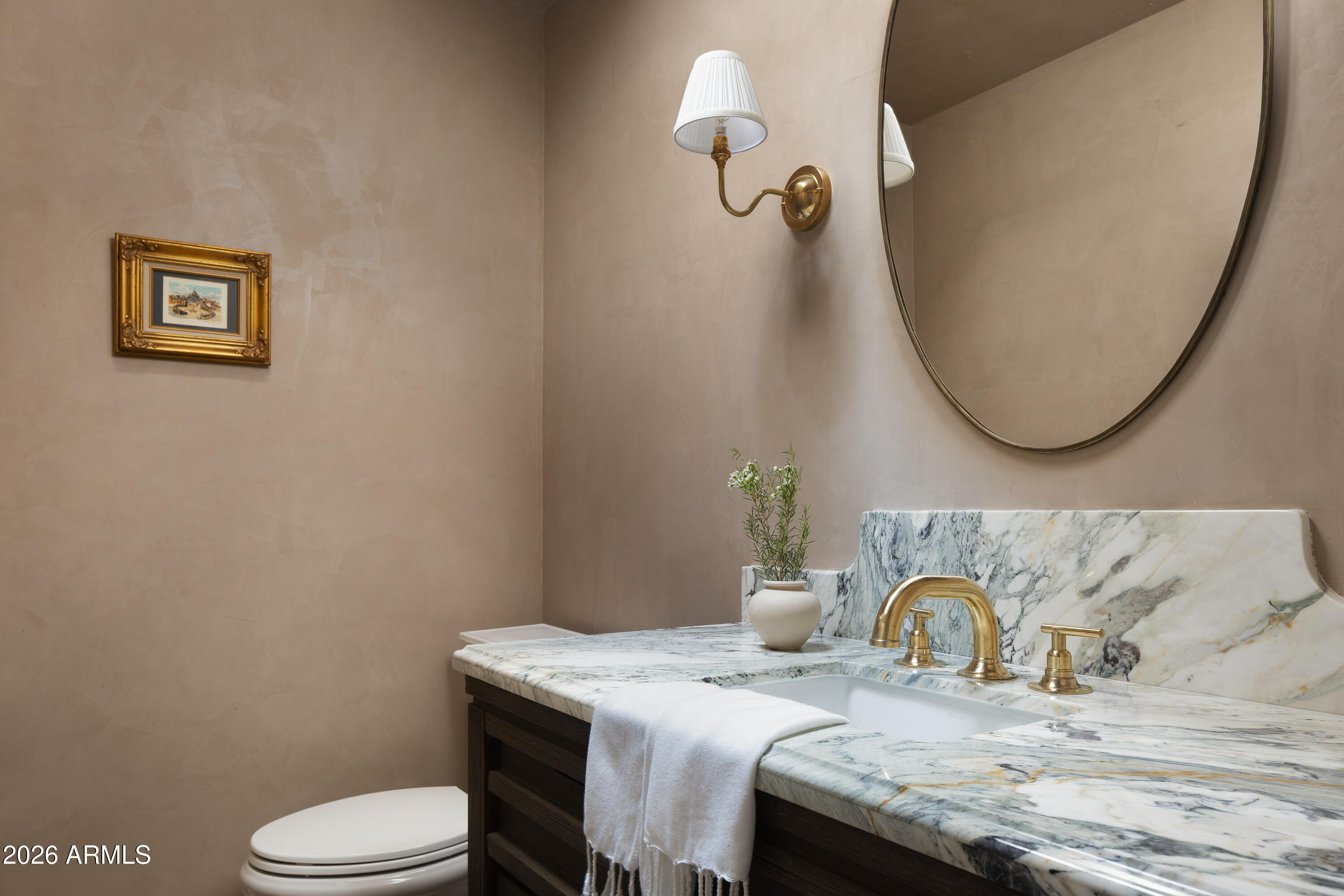 5501 East Camelback Road Phoenix, AZ 85018 - Photo 46 of 60 a bathroom with a granite countertop toilet sink and mirror