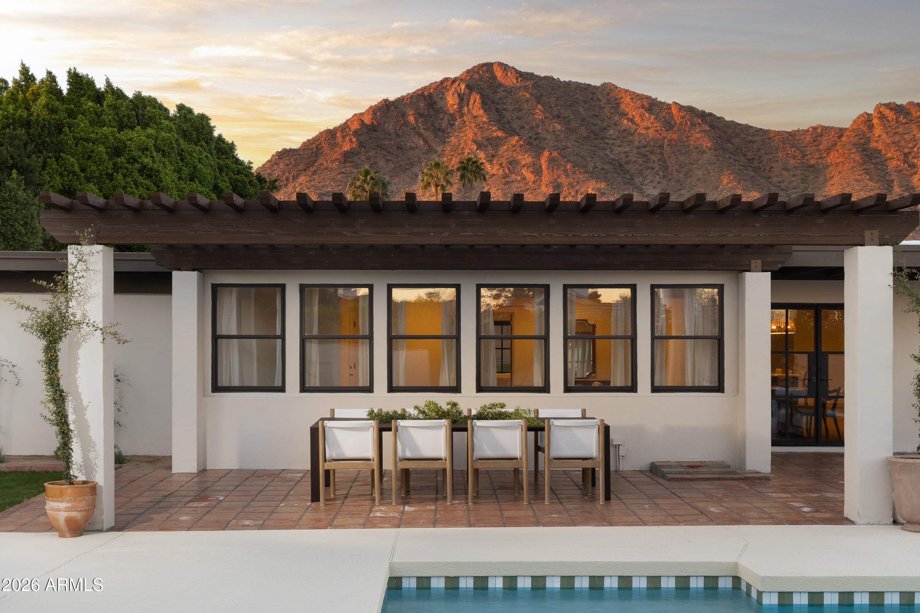 5501 East Camelback Road Phoenix, AZ 85018 - Photo 48 of 60 a view of a patio with a table and chairs
