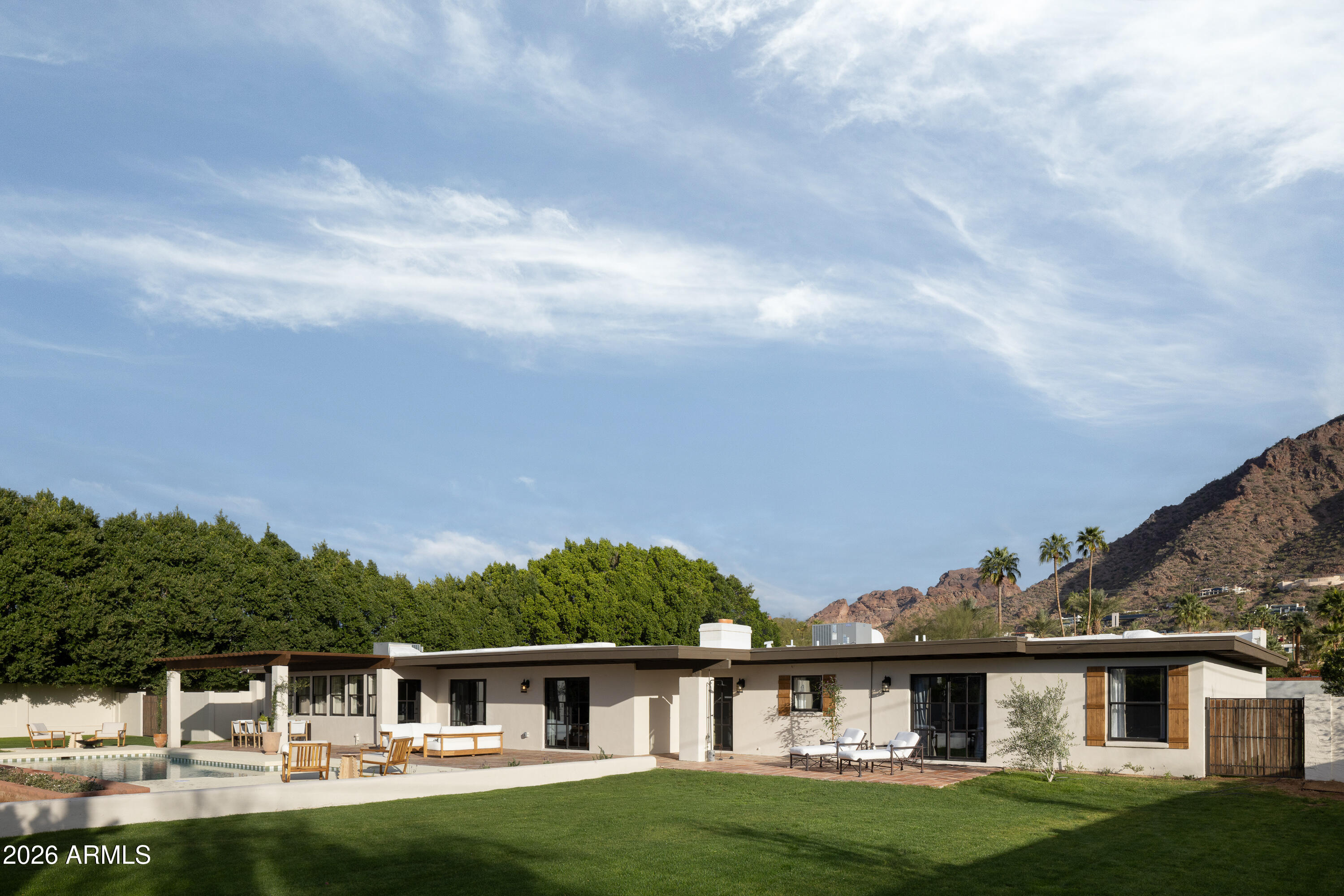 5501 East Camelback Road Phoenix, AZ 85018 - Photo 49 of 60 a front view of a house with a garden