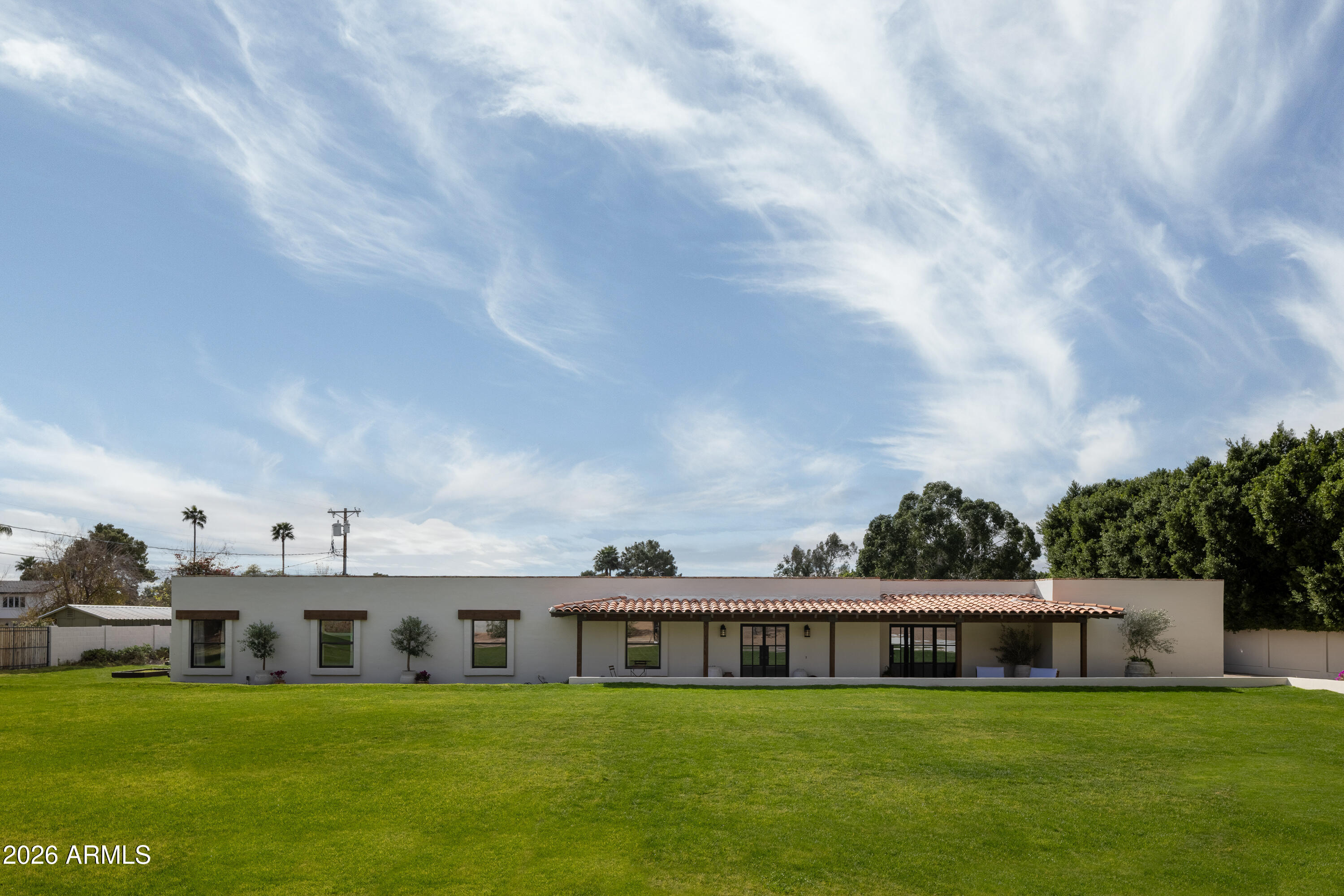 5501 East Camelback Road Phoenix, AZ 85018 - Photo 59 of 60 a view of a house with yard and sitting area
