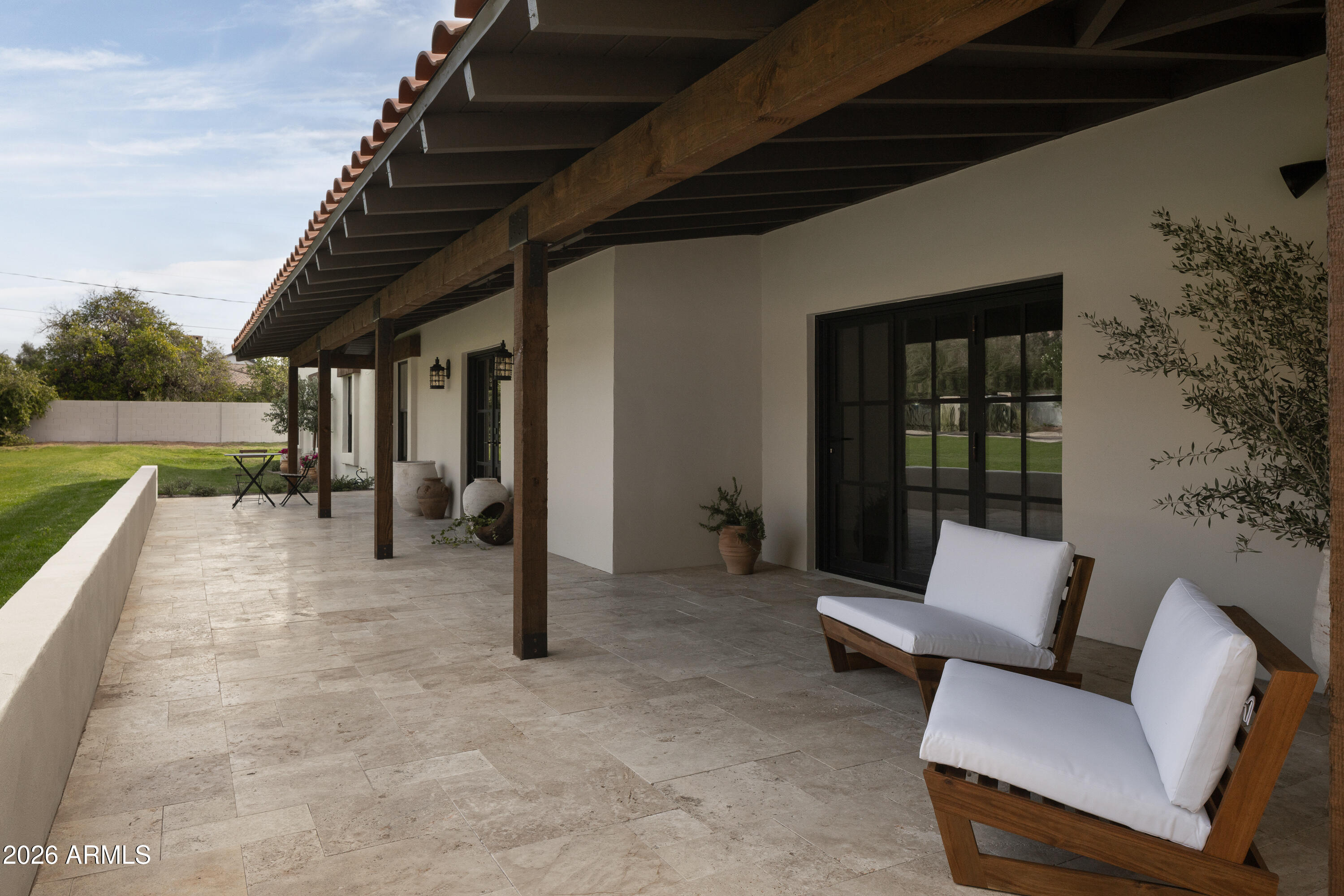 5501 East Camelback Road Phoenix, AZ 85018 - Photo 10 of 60 a balcony with furniture and a garden