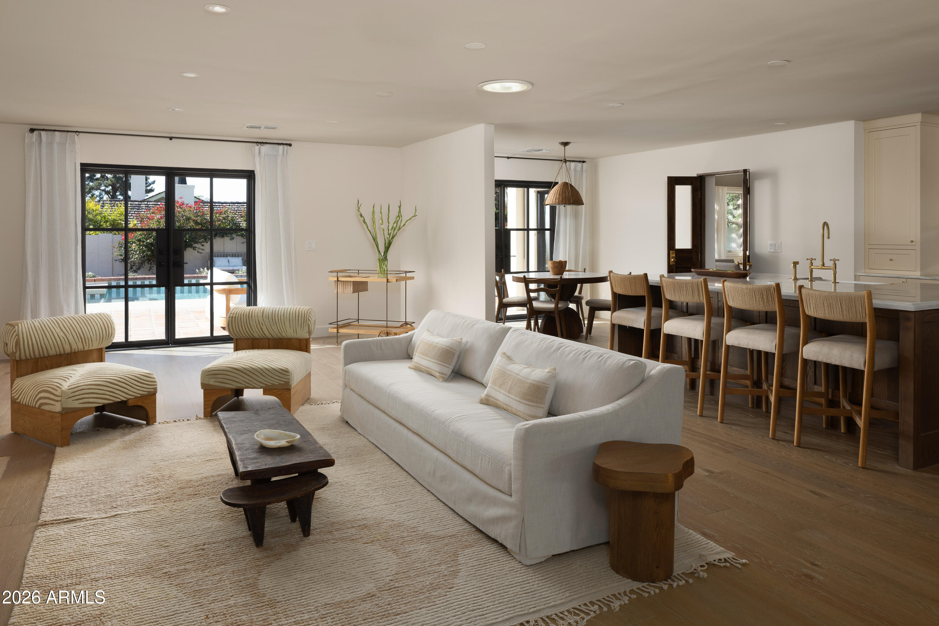 5501 East Camelback Road Phoenix, AZ 85018 - Photo 10 of 60 a living room with furniture and a large window