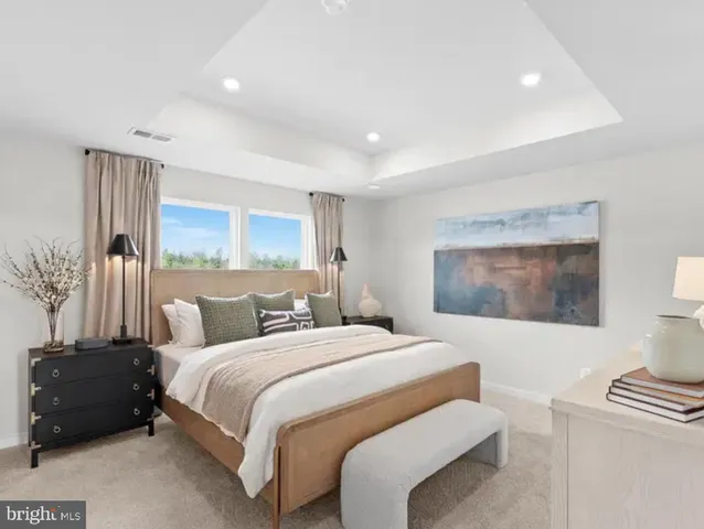 a bedroom with a bed and a lamp