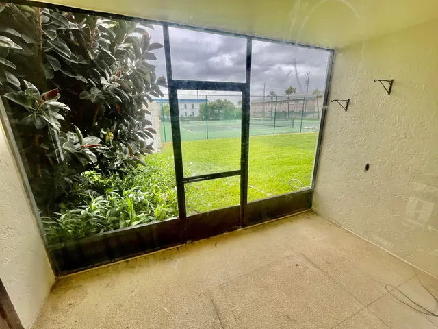 a view of a back yard from a balcony