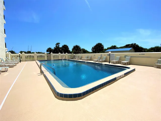 a view of a swimming pool and outdoor space