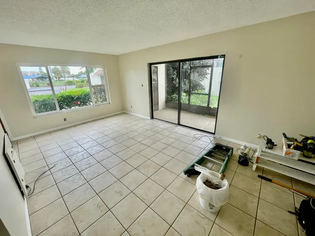 a room with gym equipment and a large window