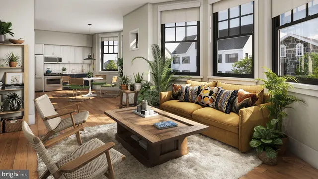 a living room with furniture fireplace and a large window