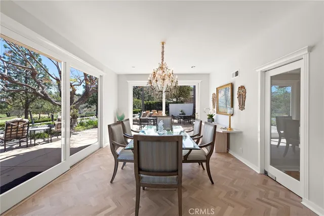 a dining room with furniture window and outside view