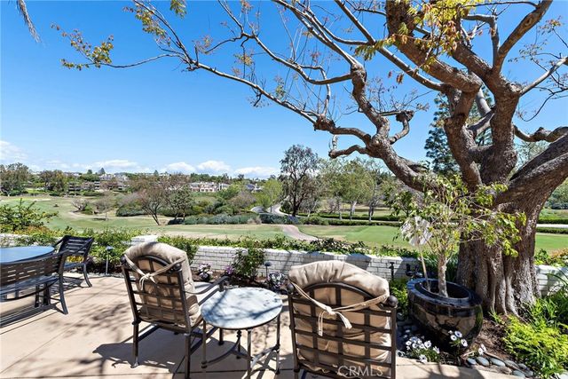 a view of yard from terrace with seating space