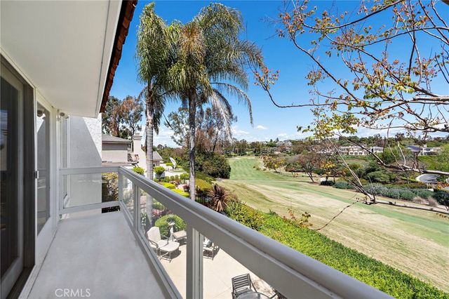 a view of balcony with a yard
