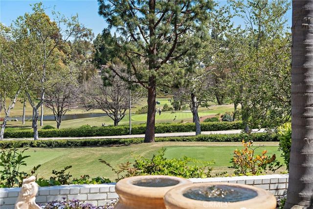 a view of a park with large trees