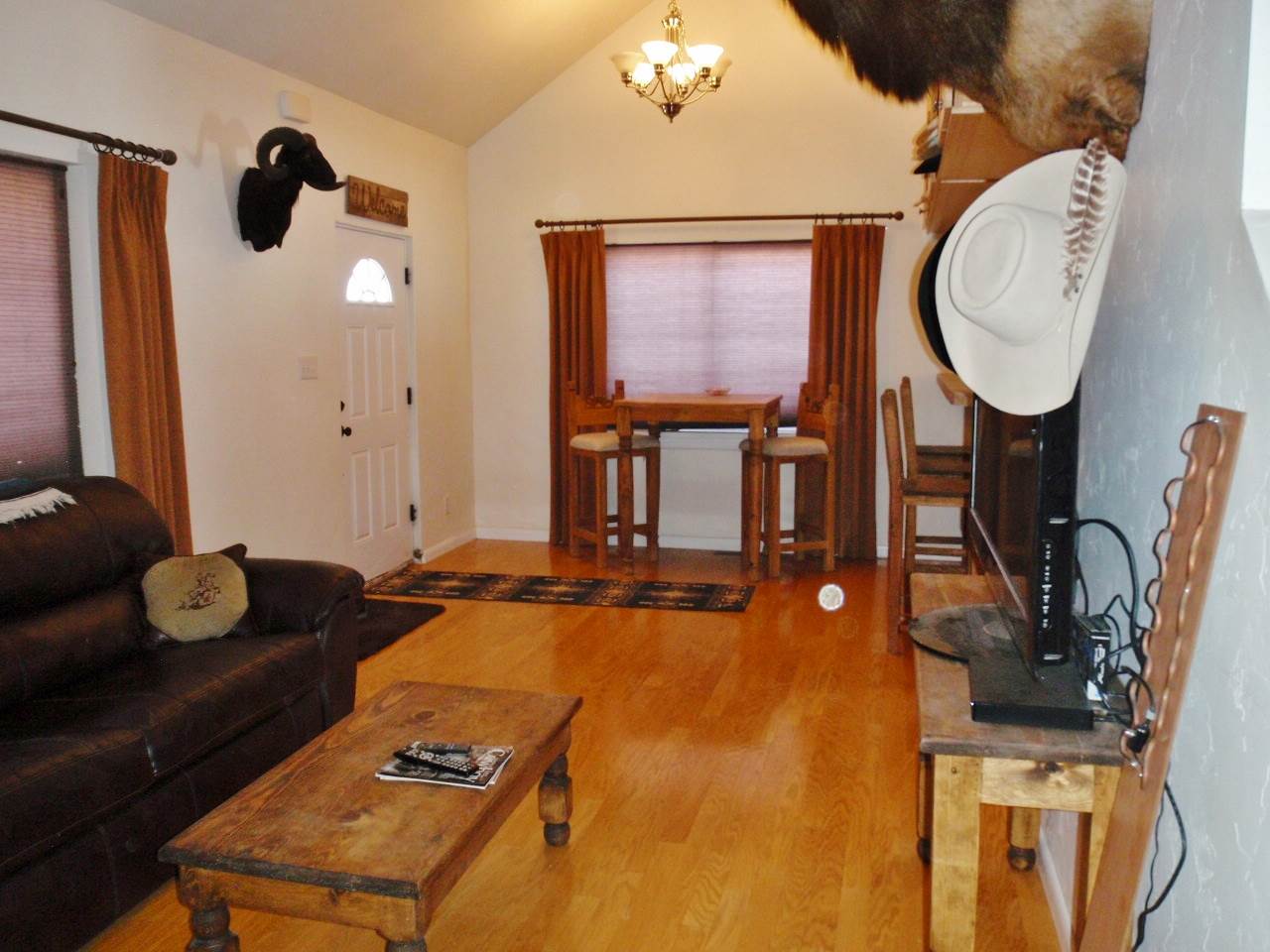 1608 12 Road Loma, CO 81524 - Photo 3 of 22 a living room with furniture a flat screen tv and a fireplace