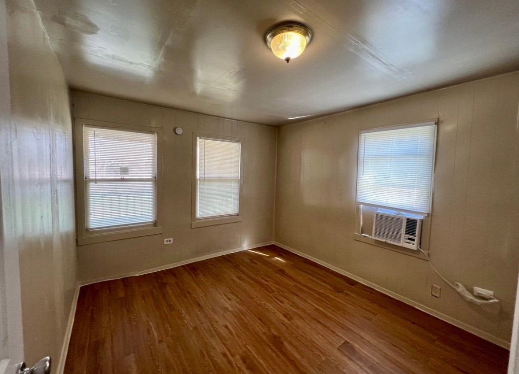 514 Ruddy Street, Unit A Lockhart, TX 78644 - Photo 4 of 9 an empty room with windows