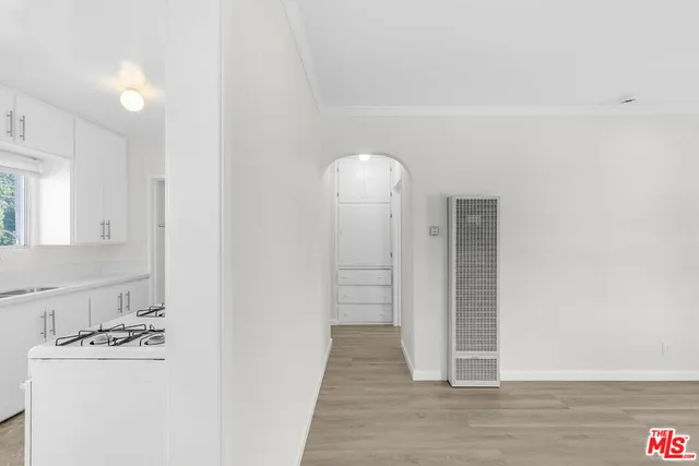 a view of a kitchen from the hallway