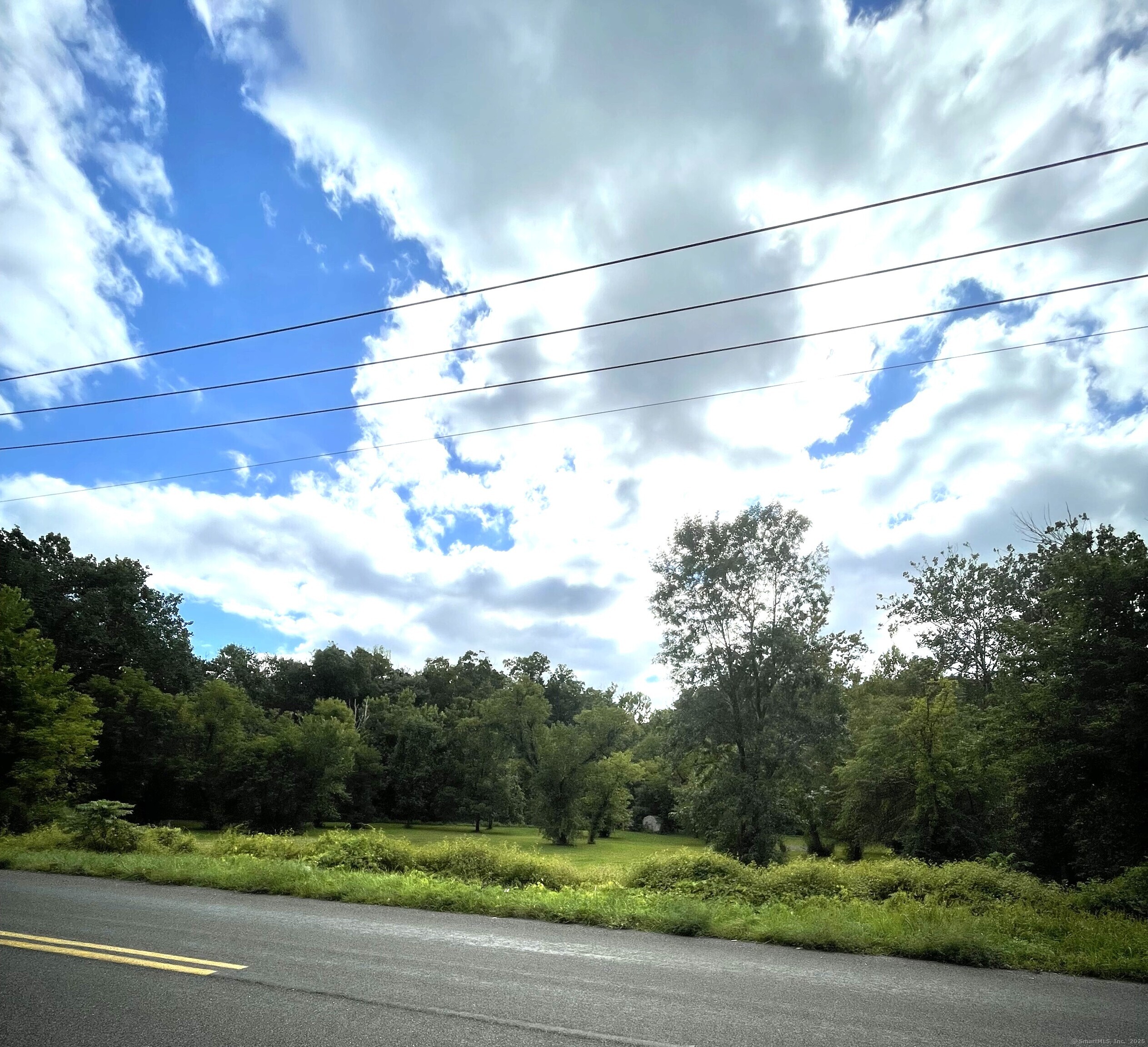 Ridge Road New Milford, CT 06776 - Photo 2 of 6 a view of a city street from a yard