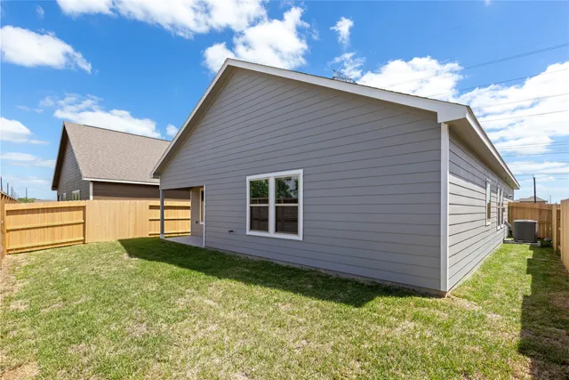 a backyard of a house with seating space