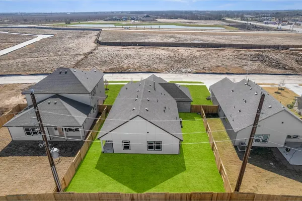a view of a swimming pool with a yard