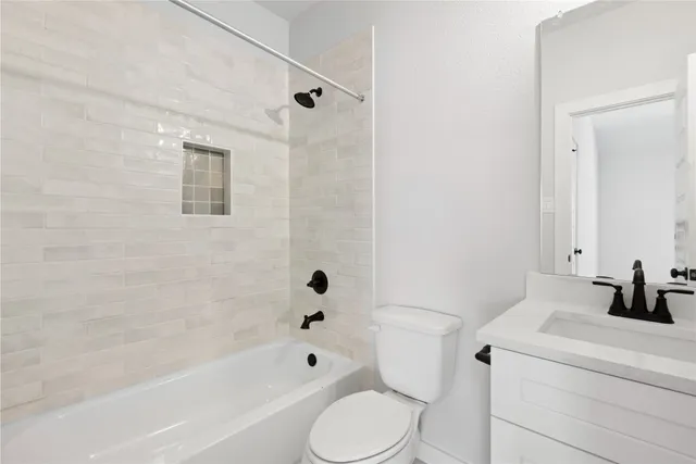 a bathroom with a sink a toilet and a bathtub