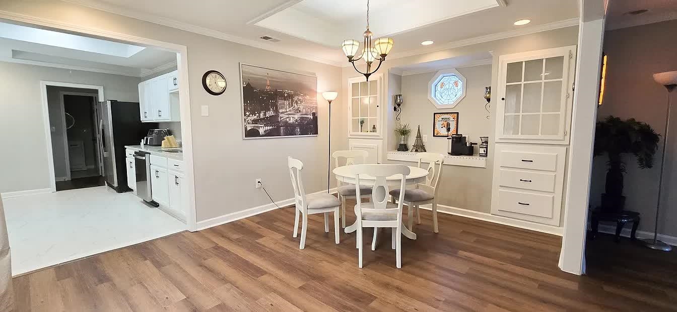 15 South Cox Street Memphis, TN 38104 - Photo 18 of 20 a view of a dining room with furniture and wooden floor