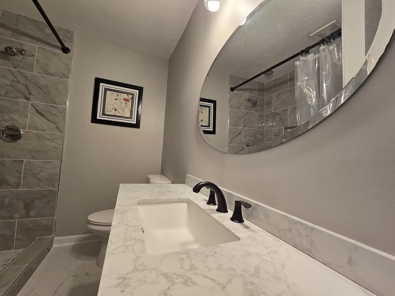 15 South Cox Street Memphis, TN 38104 - Photo 20 of 20 a bathroom with a sink a toilet and a shower