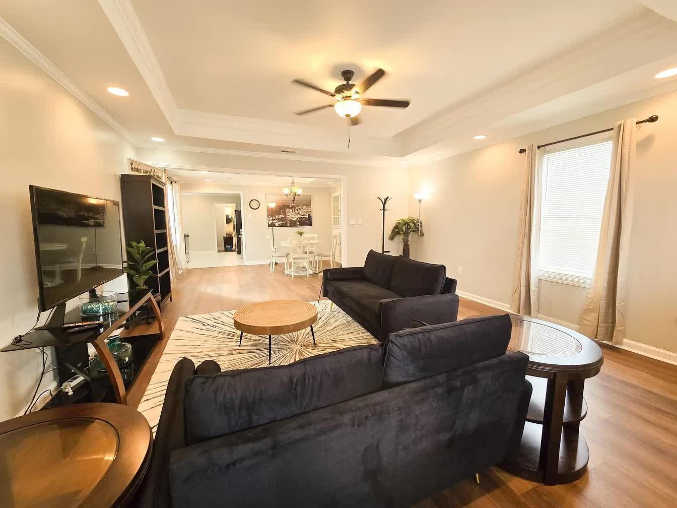 15 South Cox Street Memphis, TN 38104 - Photo 2 of 20 a living room with furniture and a flat screen tv