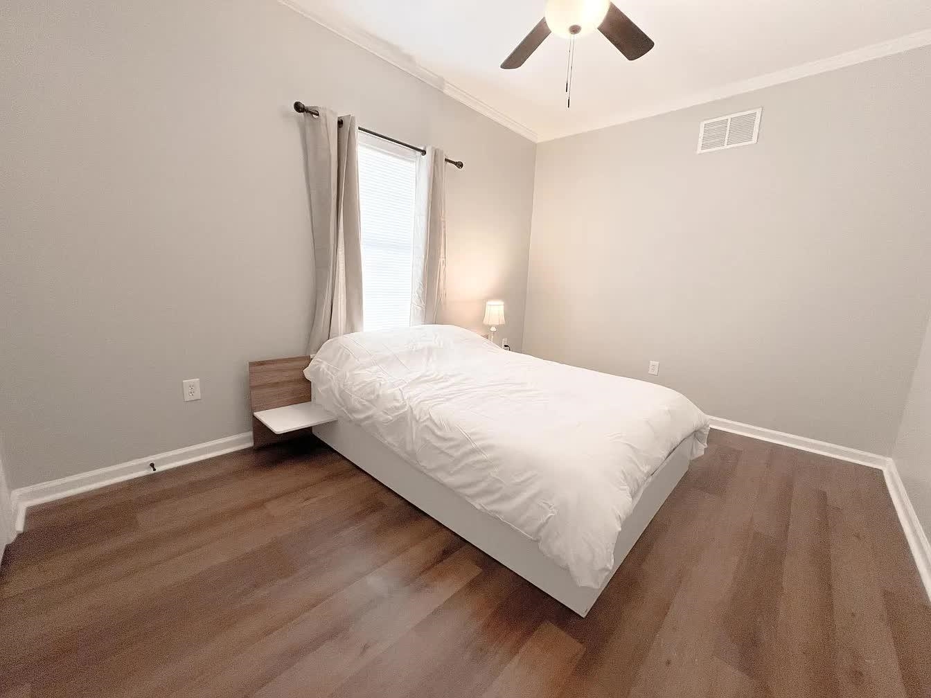 15 South Cox Street Memphis, TN 38104 - Photo 9 of 20 a spacious bedroom with a bed and a ceiling fan