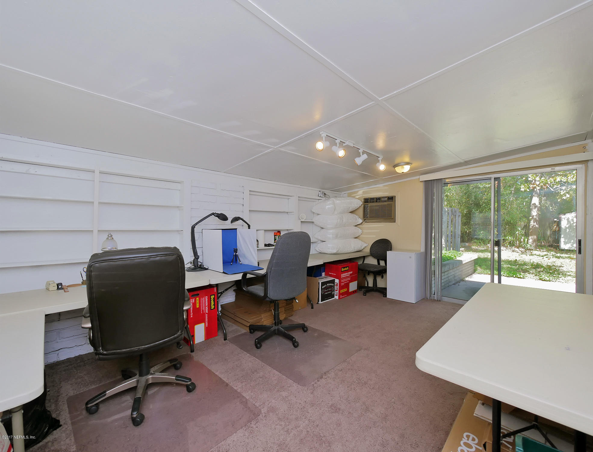 6837 Merrill Road Jacksonville, FL 32277 - Photo 5 of 13 a view of a workspace with furniture and a window