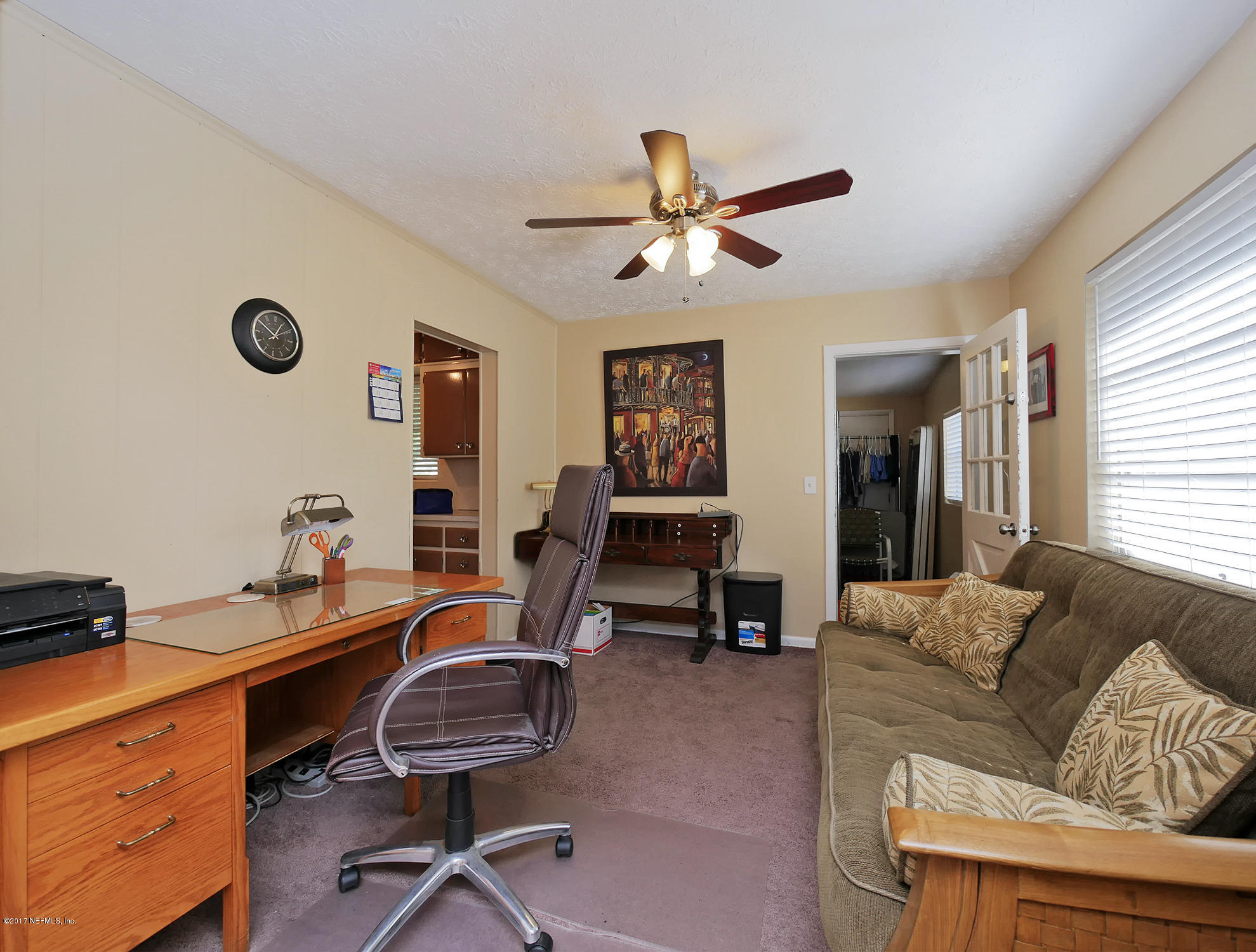 6837 Merrill Road Jacksonville, FL 32277 - Photo 8 of 13 a work room with furniture and windows