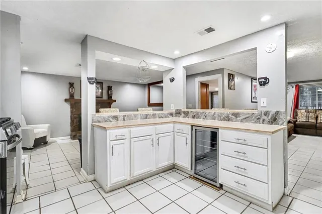 a spacious bathroom with a granite countertop sink mirror and toilet