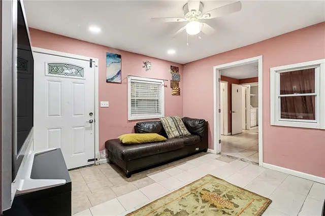 a living room with furniture and a window
