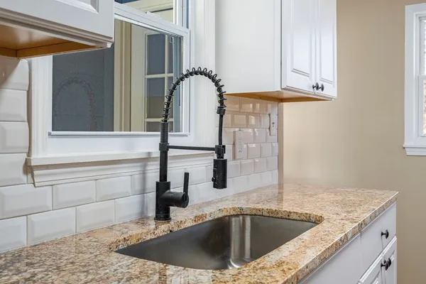 a kitchen with appliances and cabinets