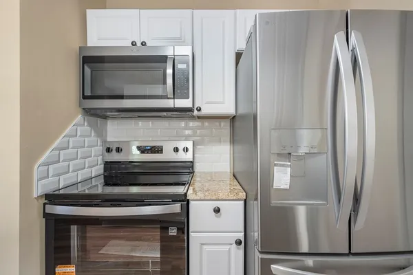 a view of a livingroom and a chandelier fan