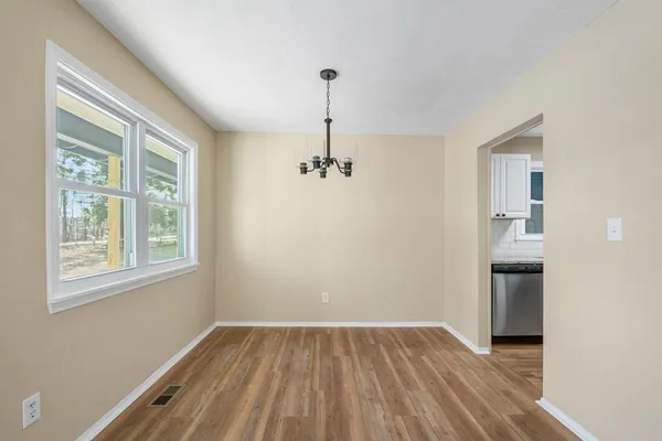 a kitchen with granite countertop stainless steel appliances a sink and counter space