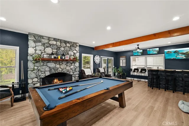 a room with pool table and flat screen tv