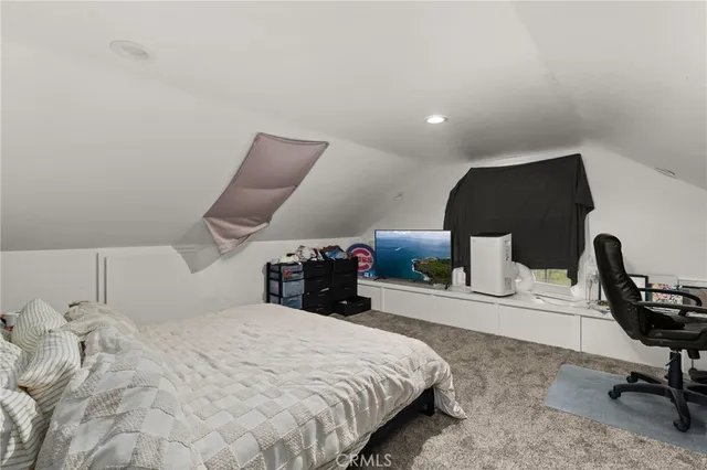 a utility room with a refrigerator and washer