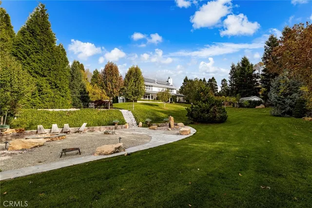 a view of a table and chairs in the garden