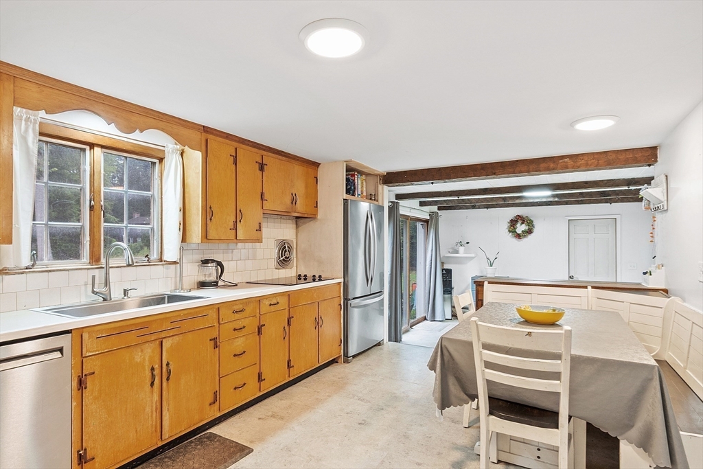 3 Thoreau Road Acton, MA 01720 - Photo 4 of 42 a bedroom with a bed and a large window