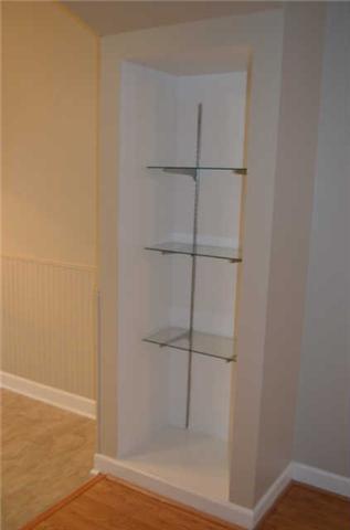 3535 Bell Road, Unit 906 Nashville, TN 37214 - Photo 6 of 19 Built in glass shelving located between the great room and dining area.