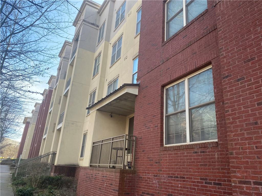 a view of a brick building next to a building