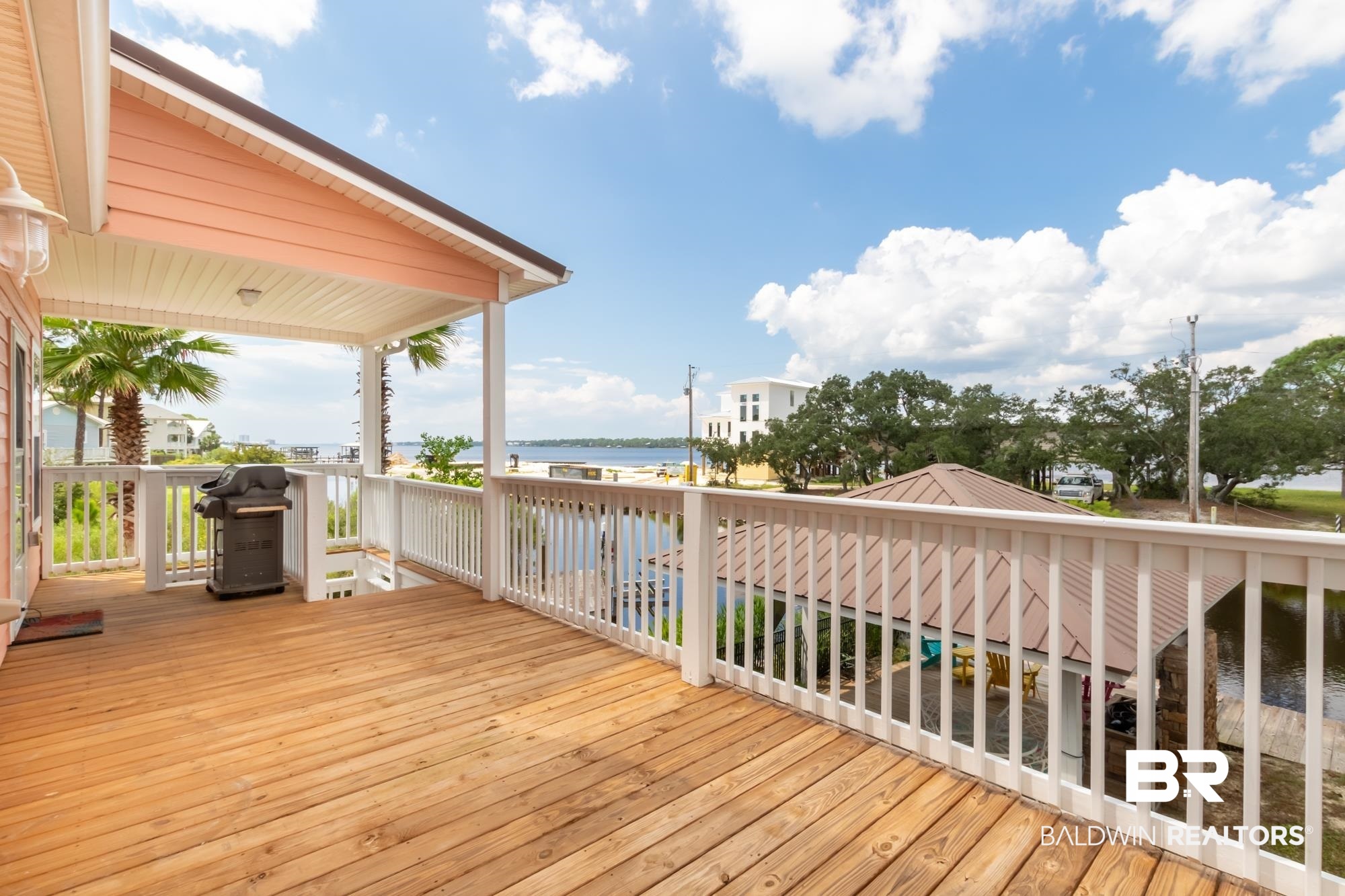 328 Windmill Ridge Road Gulf Shores, AL 36542 - Photo 44 of 47 Wooden terrace with area for grilling and a water view