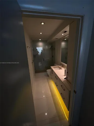 a bathroom with a sink and a shower