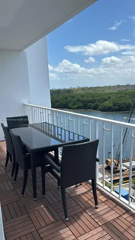 a view of balcony with furniture