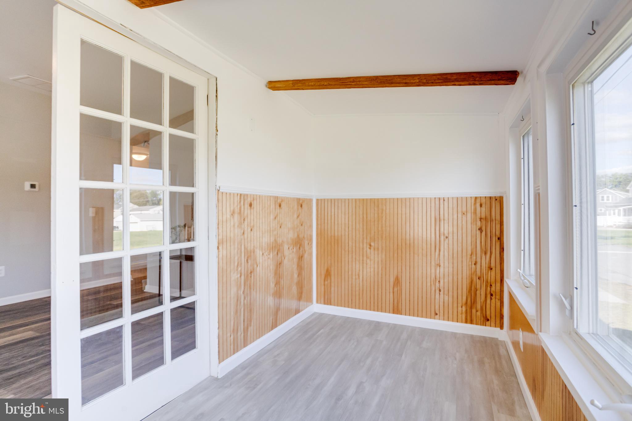 7540 Bay Front Road Sparrows Point, MD 21219 - Photo 25 of 63 a view of wooden floor and windows in a room