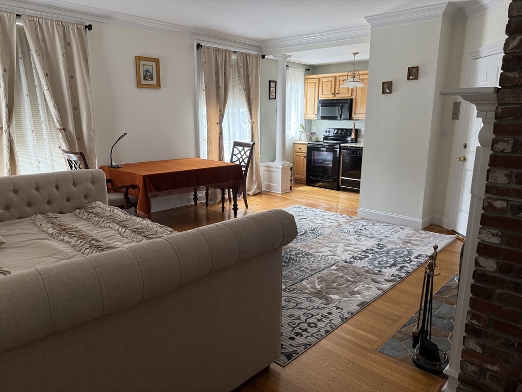 5 Porter Road, Unit 202 Andover, MA 01810 - Photo 8 of 17 a living room with furniture and a flat screen tv