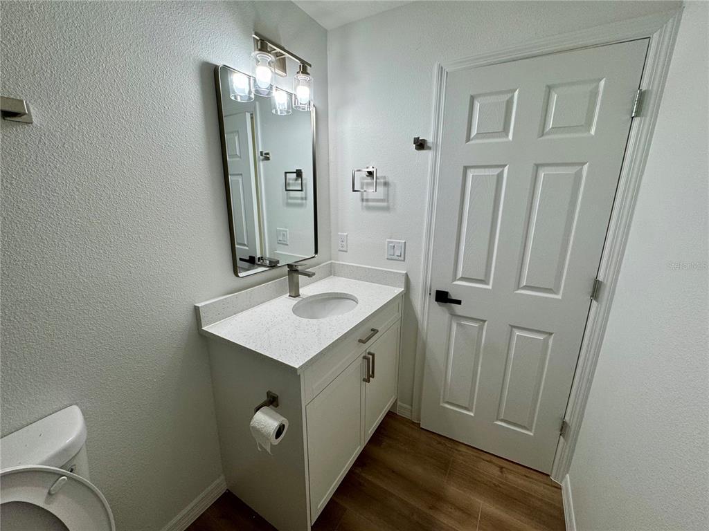 3401 South Highlands Avenue Inverness, FL 34452 - Photo 12 of 16 a bathroom with a sink and a mirror