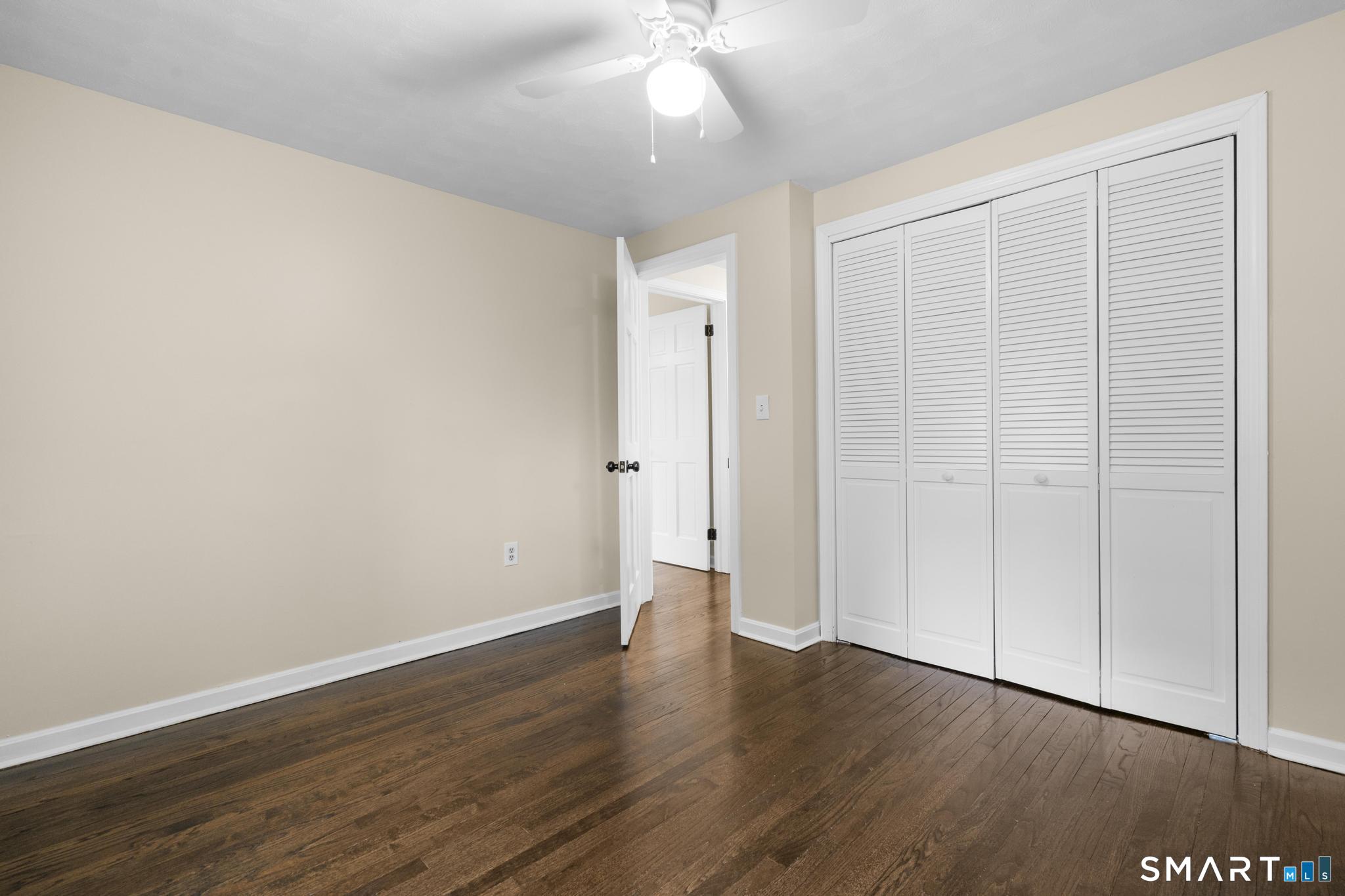 7 Sycamore Terrace Windham, CT 06280 - Photo 24 of 40 a view of an empty room with wooden floor