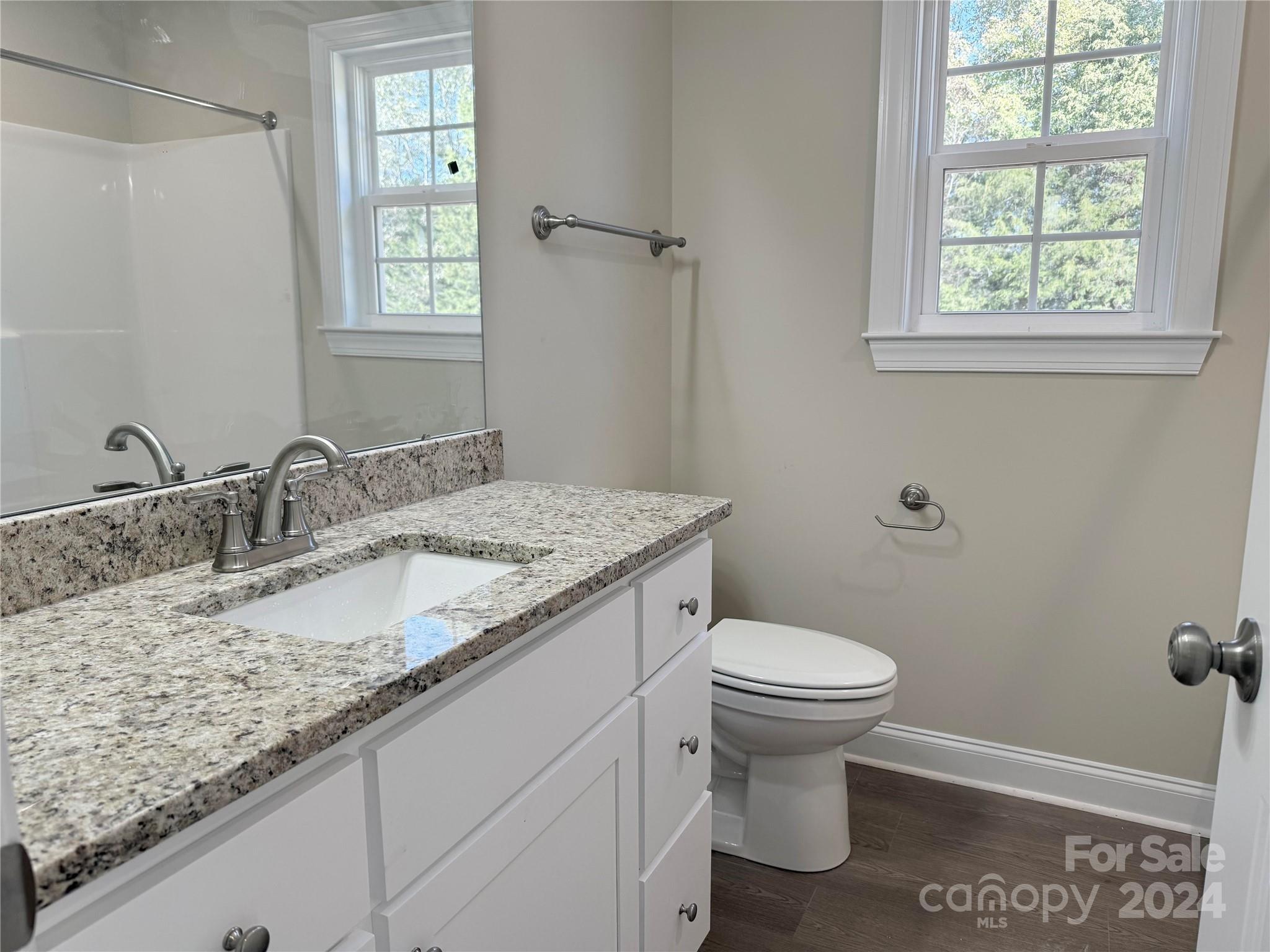 2438-j B J B Denton Road Lancaster, SC 29720 - Photo 12 of 23 a bathroom with a granite countertop sink toilet and a mirror